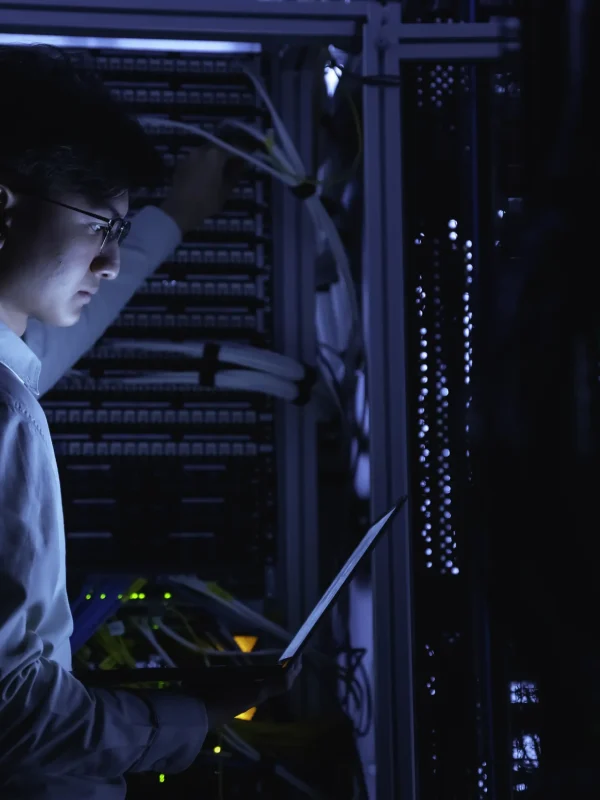 computer-engineer-is-setting-up-network-server-roomsystems-maintenance-technicianmale-engineer-working-server-room-modern-data-center (1)