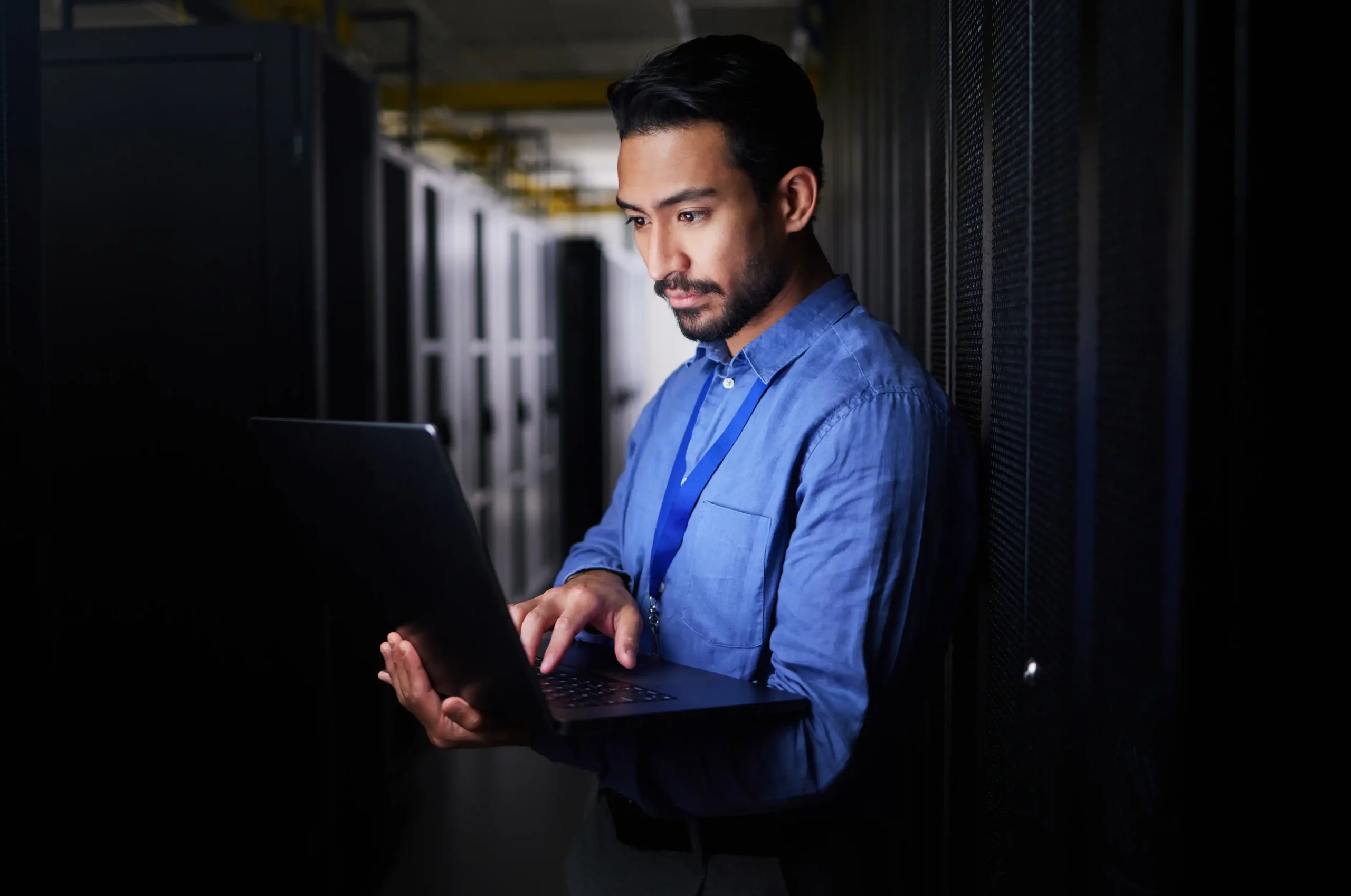 man-server-room-laptop-programming-system-management-data-center-solution-coding-night-business-person-engineering-computer-information-technology-power-check-basement